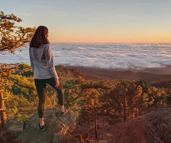 Girl looking at the horizon in Tenerife, Spain.